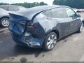 2023 Tesla Model Y — photo 4 of 18 | VIN 7SAYGAEEXPF913727