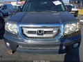 2011 Honda Pilot — photo 12 of 16 | VIN 5FNYF4H50BB079117