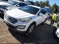 2013 Hyundai Santa Fe — photo 2 of 11 | VIN 5XYZU3LA1DG091054