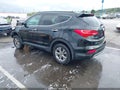 2016 Hyundai Santa Fe — photo 3 of 17 | VIN 5XYZU3LB1GG330549