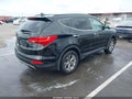 2016 Hyundai Santa Fe — photo 4 of 17 | VIN 5XYZU3LB1GG330549