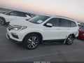 2018 Honda Pilot — photo 14 of 16 | VIN 5FNYF5H98JB008769