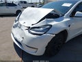 2022 Tesla Model Y — photo 6 of 15 | VIN 7SAYGDEE9NF506674