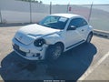 2013 Volkswagen Beetle — photo 2 of 17 | VIN 3VWFP7AT0DM625747