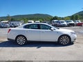 2014 Lincoln MKS — photo 13 of 16 | VIN 1LNHL9FT1EG604120