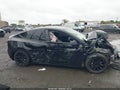 2024 Tesla Model Y — photo 11 of 14 | VIN 7SAYGDEE5RA218332