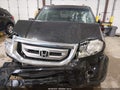 2011 Honda Pilot — photo 13 of 17 | VIN 5FNYF4H9XBB027433