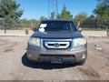 2011 Honda Pilot — photo 12 of 16 | VIN 5FNYF4H55BB065942