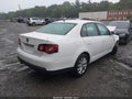 2010 Volkswagen Jetta — photo 4 of 11 | VIN 3VWRZ7AJ9AM122025