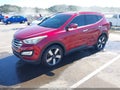 2013 Hyundai Santa Fe — photo 2 of 17 | VIN 5XYZUDLA2DG105467