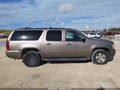 2012 Chevrolet Suburban 1500 — photo 13 of 17 | VIN 1GNSCJE06CR246329