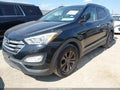 2016 Hyundai Santa Fe — photo 2 of 16 | VIN 5XYZU3LB2GG335873