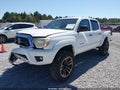 2014 Toyota Tacoma — photo 2 of 16 | VIN 5TFLU4EN5EX090399