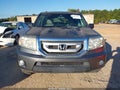 2011 Honda Pilot — photo 12 of 16 | VIN 5FNYF3H75BB001315