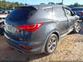 2015 Hyundai Santa Fe — photo 4 of 16 | VIN 5XYZT3LB5FG270809