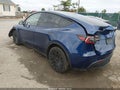 2023 Tesla Model Y — photo 3 of 19 | VIN 7SAYGAEE6PF834801