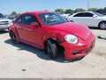 2012 Volkswagen Beetle — photo 1 of 11 | VIN 3VWJP7AT2CM601054