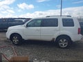 2011 Honda Pilot — photo 14 of 16 | VIN 5FNYF3H62BB033971