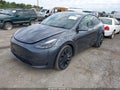 2022 Tesla Model Y — photo 2 of 18 | VIN 7SAYGDEF5NF380130