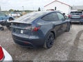 2022 Tesla Model Y — photo 4 of 18 | VIN 7SAYGDEF5NF380130