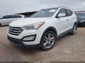 2016 Hyundai Santa Fe — photo 2 of 16 | VIN 5XYZWDLA0GG324801