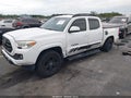 2018 Toyota Tacoma — photo 2 of 16 | VIN 5TFAX5GN6JX119839