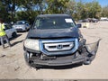 2011 Honda Pilot — photo 12 of 16 | VIN 5FNYF4H40BB079772