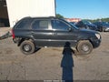 2006 Kia Sportage — photo 14 of 17 | VIN KNDJF724767278440