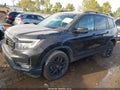 2024 Honda Passport — photo 14 of 16 | VIN 5FNYF8H84RB014041