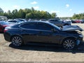 2015 Acura TLX — photo 14 of 17 | VIN 19UUB3F78FA001404