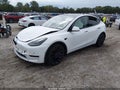 2022 Tesla Model Y — photo 2 of 16 | VIN 7SAYGDEF8NF548472