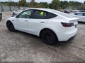 2022 Tesla Model Y — photo 3 of 16 | VIN 7SAYGDEF8NF548472