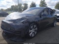 2024 Tesla Model Y — photo 2 of 14 | VIN 7SAYGDEE9RA240317