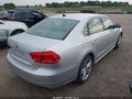2014 Volkswagen Passat — photo 4 of 11 | VIN 1VWBN7A31EC027304