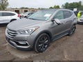 2018 Hyundai Santa Fe — photo 2 of 16 | VIN 5XYZWDLA3JG518908