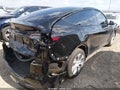 2023 Tesla Model Y — photo 4 of 18 | VIN 7SAYGDEE4PA058957