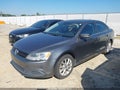 2014 Volkswagen Jetta — photo 2 of 17 | VIN 3VWD07AJ0EM388303