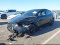 2022 Tesla Model Y — photo 2 of 15 | VIN 7SAYGDEE2NF426472