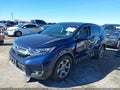 2018 Honda CR-V — photo 2 of 17 | VIN 7FARW1H82JE006461
