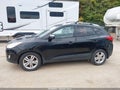 2013 Hyundai Tucson — photo 12 of 15 | VIN KM8JUCAC6DU670388