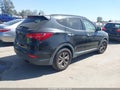 2014 Hyundai Santa Fe — photo 4 of 16 | VIN 5XYZU3LB7EG186700