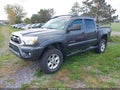 2015 Toyota Tacoma — photo 2 of 16 | VIN 3TMLU4EN0FM176369