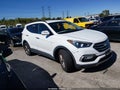 2017 Hyundai Santa Fe — photo 1 of 16 | VIN 5NMZUDLB2HH047980