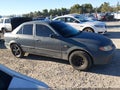 2003 Mazda Protege — photo 14 of 17 | VIN JM1BJ225730121235