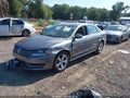 2014 Volkswagen Passat — photo 2 of 15 | VIN 1VWBS7A38EC116005