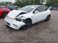 2023 Tesla Model Y — photo 2 of 15 | VIN 7SAYGDEF8PF665455