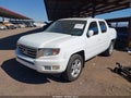 2014 Honda Ridgeline — photo 2 of 17 | VIN 5FPYK1F59EB012072