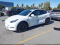 2023 Tesla Model Y — photo 2 of 15 | VIN 7SAYGDEF1PF741453
