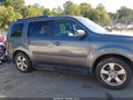 2013 Honda Pilot — photo 13 of 16 | VIN 5FNYF4H5XDB010907