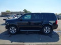 2014 Honda Pilot — photo 15 of 17 | VIN 5FNYF4H79EB011064